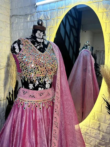The way the light reflects off the mirrors is just magical. This lehenga is designed to make you the center of attention.