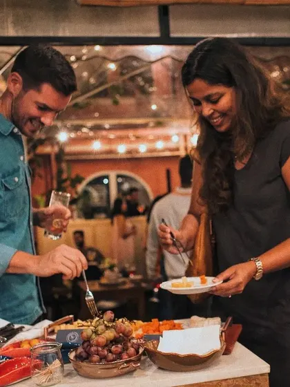A happy couple enjoying the buffet spread at the Terra Luna brand launch I catered.