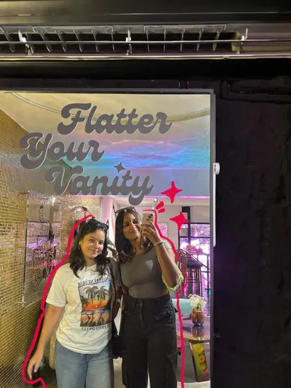 Mirror mirror on the wall. A selfie with a friend, with a red outline to frame us.