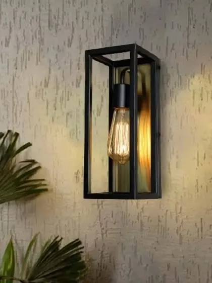 This wall lamp exudes nostalgic vibes with its black rectangular frame and brushed gold interior. The design is perfect for showcasing a vintage Edison bulb, adding a touch of industrial-chic to your decor.
