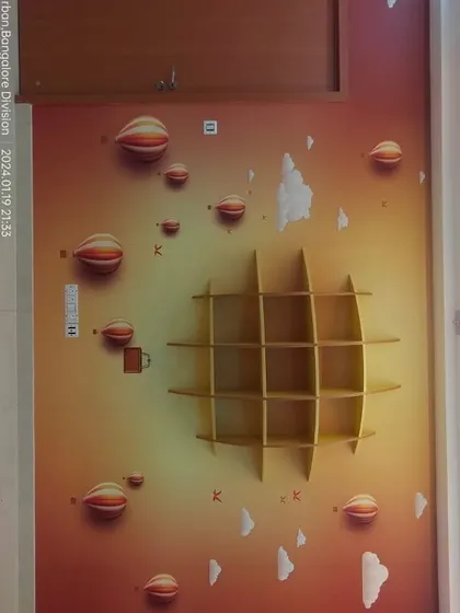 A 3D-effect wallpaper with hot air balloons, with a wooden shelf installed over it.