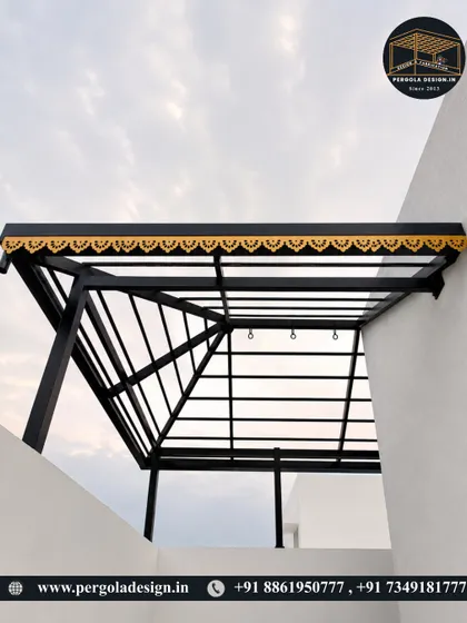 A view from below of the black pergola frame, showing the clean lines and sturdy construction before the roof is added.