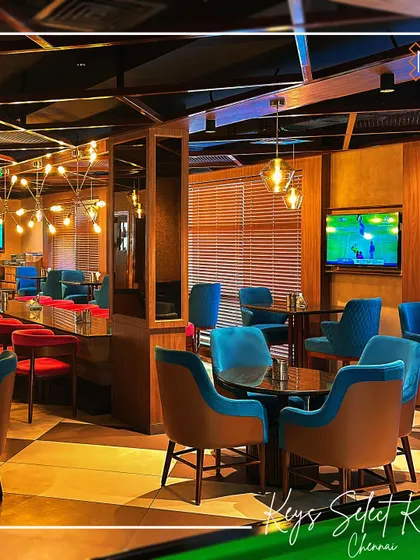 The Unlock Bar at Keys Select, Chennai, is designed for socializing. This view shows the comfortable lounge seating and ambient lighting that create a relaxed yet sophisticated bar environment.