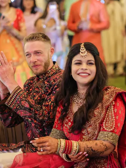 The Sangeet is a night of pure celebration. The couple and their guests enjoy the performances under a canopy of colorful drapes and lights, a signature of the vibrant events we plan.