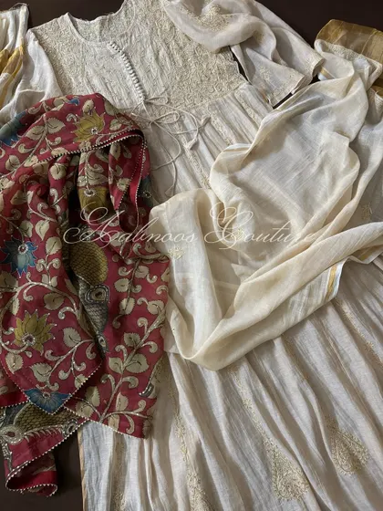 A beautifully draped shot of the full Anarkali ensemble, showcasing the flowing silhouette of the tissue chanderi fabric and the artistry of the Kalamkari dupatta.