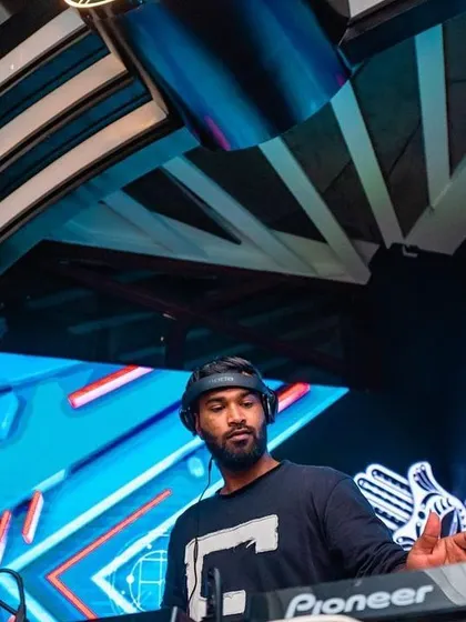 In my element, surrounded by cool blue visuals. The combination of great music and atmospheric lighting creates an unforgettable party environment.