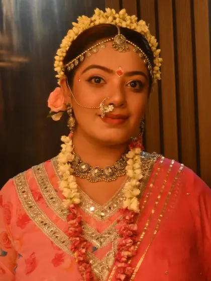 Embodying Radha. For this special look at 'Rangilo Re', I chose a soft pink outfit adorned with fresh flower jewelry to capture the divine and gentle essence of Radha.