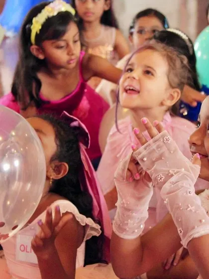 Eyes filled with wonder. Our youngest dancers are mesmerized by the festive decorations and activities at our holiday party.