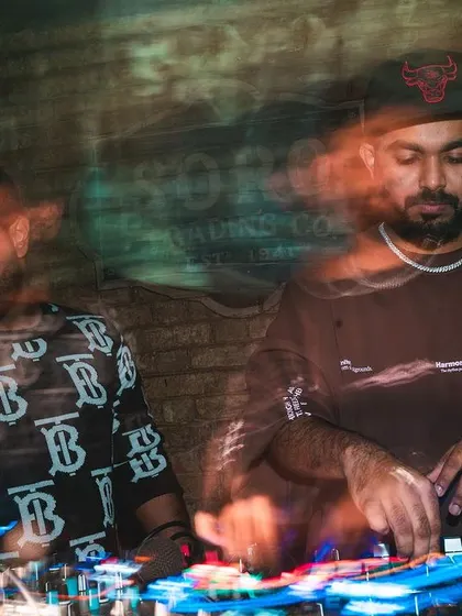 A long exposure shot capturing the motion and energy of the DJ booth. Here I am, deep in the mix alongside a fellow DJ, creating a seamless flow of music.