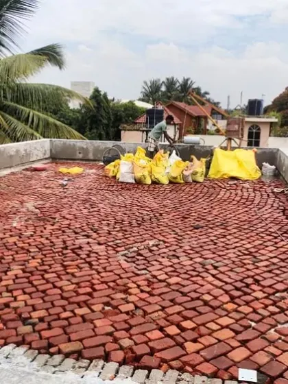 We often use traditional techniques like Brickbat Coba for waterproofing. This time-tested method provides excellent waterproofing and thermal insulation for flat roofs. It's a labor-intensive process, but we believe it offers the best long-term solution.