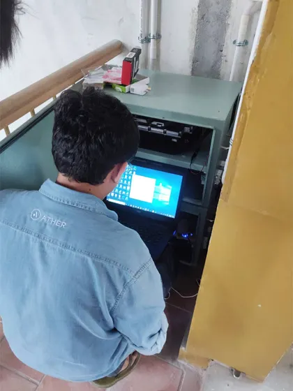 A technician from our partner, Ather Energy, commissioning the battery management system for Bengaluru's largest residential Lithium-ion setup. This ensures the batteries operate safely and efficiently.