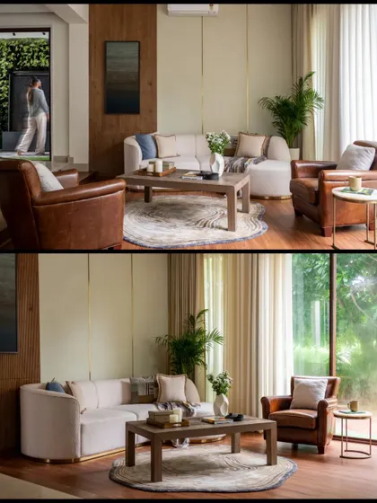 The formal living room in "Villa Tranquility," where we paired a modern curved sofa with classic leather armchairs. The design is a sophisticated blend of contemporary comfort and timeless elegance.