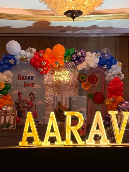 A full view of the stage setup, including the large marquee letters spelling "AARAV" which provide a fantastic photo opportunity.