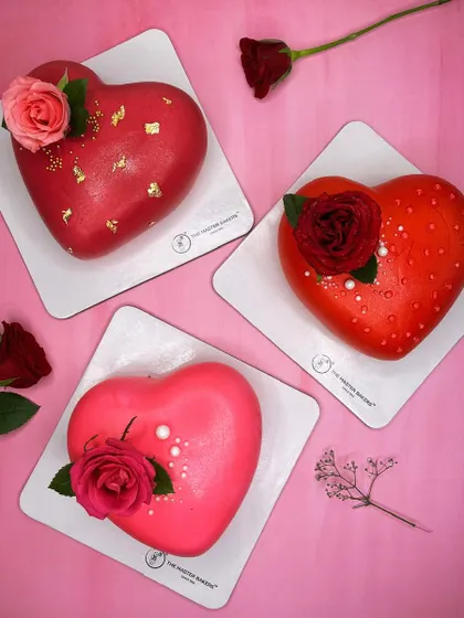 Love comes in many flavors. Here is a trio of our heart-shaped cakes, perfect for Valentine's Day, anniversaries, or just to say "I love you." Each one is uniquely decorated, from gold-flaked red fondant to fresh roses.
