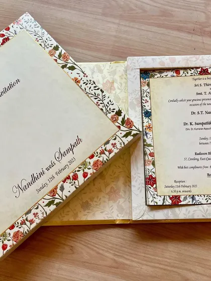 A classic floral invitation with a matching frame for the main insert. The design is timeless and can be customized in various colors.