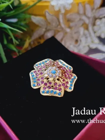 A close-up of the "Anokhi" adjustable ring in its gift box. The multi-coloured stones make it a versatile piece that can be paired with many different outfits.