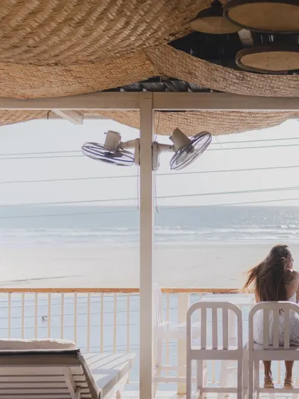 A quiet, atmospheric shot from a beachside cafe. This photo sets the scene and captures the serene, laid-back vibe of a Goan pre-wedding shoot.