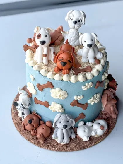 This cake is one of my all-time favorites, made for a true dog lover. It features a variety of handmade fondant dog figurines, each with its own personality, sitting on and around a buttercream cake. It’s a perfect example of how we can turn your passion into a delicious piece of edible art.