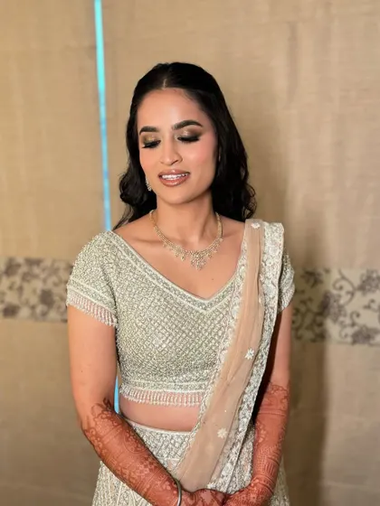 A beautiful shot of Manpreet, all ready for her engagement. The soft smokey eye and voluminous curls create a look that is both glamorous and sophisticated.