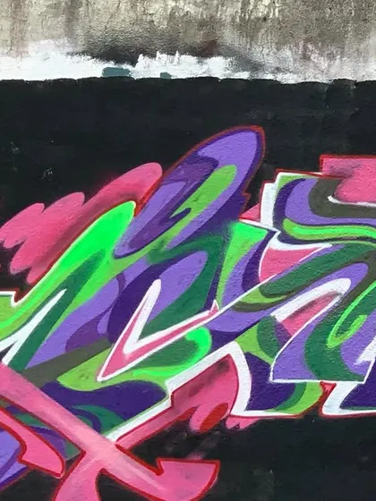 A different angle of the purple and green piece, showing how it fits into its urban environment.