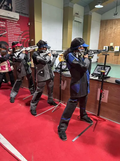 A line of our female rifle shooters, demonstrating the powerful stance and focus required in this precision sport.