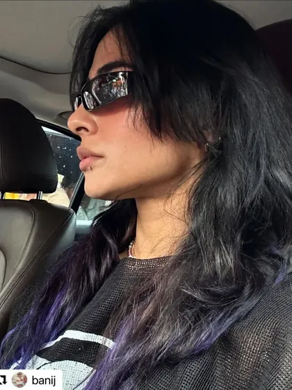 Another shot from Bani J, showing how her creative color evolved into a cool purple tone over time.