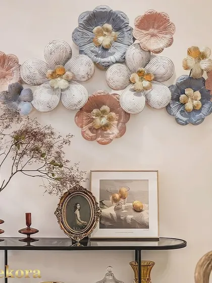 A modern flower wall decor piece in pastel shades of pink and blue, perfect for a contemporary or shabby chic interior.