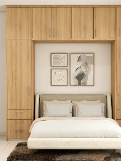 I designed this space-saving bedroom with a bed nook surrounded by floor-to-ceiling wardrobes and drawers. This is a perfect solution for smaller rooms, providing massive amounts of storage without feeling cramped.