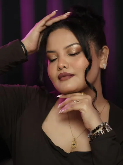 With eyes closed, the blended eyeshadow and sharp winged liner are the stars. This is a versatile look that can be adapted for any occasion.