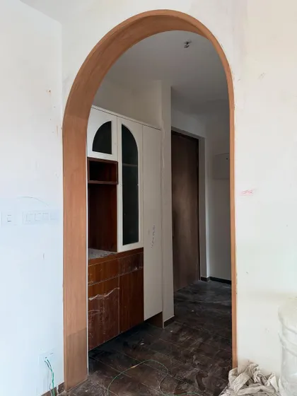 An archway in progress. Even before the final paint and finishing, you can see how this simple architectural element adds character and elegance, creating a beautiful frame for the view into the next room.