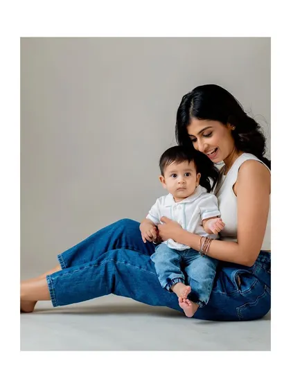 A beautiful, simple portrait of a mother and her baby, perfect for capturing the bond at any milestone.