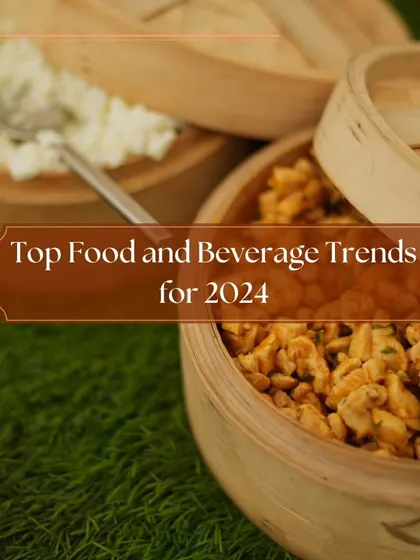 A close-up of our food offerings in traditional wooden steamers, highlighting the top food and beverage trends for 2024. We focus on fresh, beautifully presented dishes.