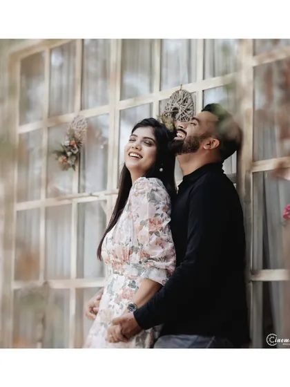 Pure joy and laughter captured during a cafe shoot. My goal is to make you feel comfortable enough to forget the camera is there, allowing for these genuine, unposed moments.