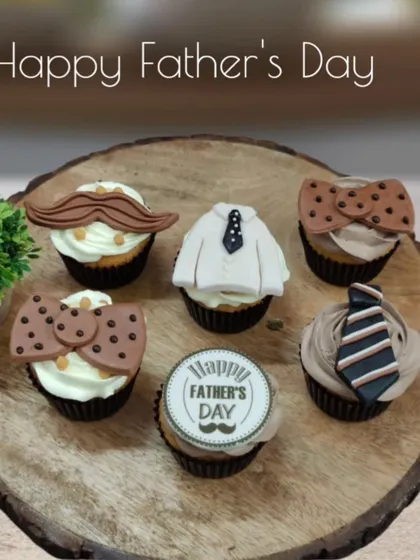 These Father's Day themed cupcakes are a fun and delicious way to celebrate Dad. The set includes various designs like shirts, ties, and moustaches, all handcrafted from fondant and placed on our signature eggless cupcakes.