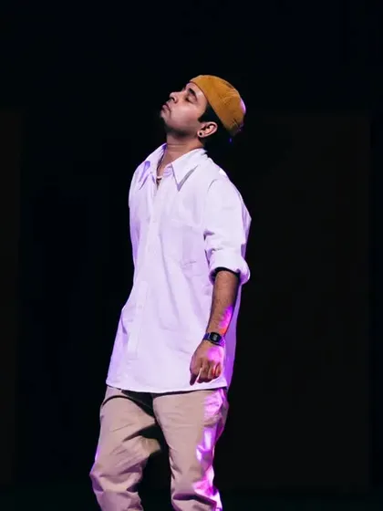 A student holding the stage during a solo section of a group piece. I choreograph moments that allow individual dancers to shine and showcase their unique strengths.