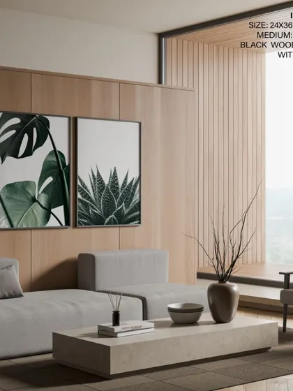 A sleek, modern living room featuring our two-piece botanical set. The black wood frames provide a sharp, contemporary edge to the organic feel of the Monstera and Succulent prints.