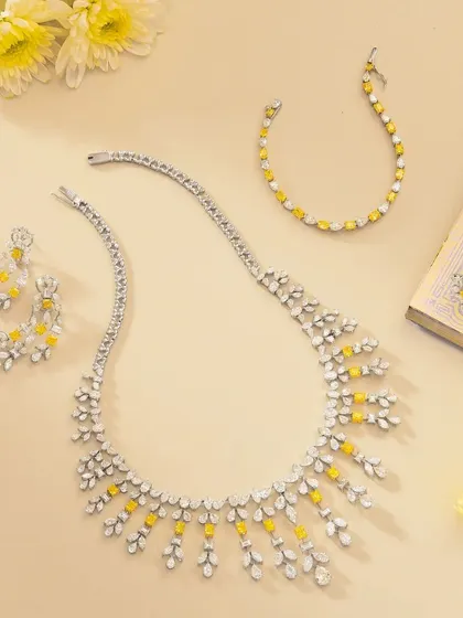 A beautiful flatlay of a fine jewelry set from Nanagram Jewels. We created this on-location at their store, using soft lighting, flowers, and a book to build an elegant and timeless lifestyle scene.