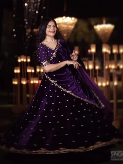 For a night of glamour and celebration, this opulent purple velvet lehenga makes a statement. It is hand-embroidered with a dazzling mix of pearls, dabka, and katdana for a truly stellar sangeet or reception look.