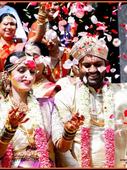 A moment of pure joy as the couple is showered with petals by their loved ones. This action shot is full of life, color, and celebration.