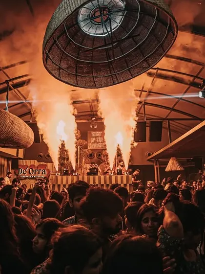 A wide shot of the incredible setup at De'orra Chandigarh. The combination of a packed crowd and vertical CO2 jets creates an electrifying atmosphere.