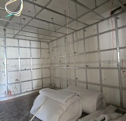 The foundation of great sound is expert construction. This is the acoustic framing stage of a project, where I build a multi-layered wall system to ensure the room is perfectly isolated and treated for optimal audio performance before any finishing touches are added.