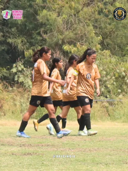 The team walking together on the pitch after a play. This image captures the constant communication and unity within the squad.