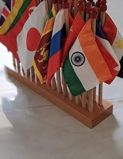 Our curriculum extends to the world. This set of miniature flags is part of our cultural studies area, introducing children to geography, diversity, and the interconnectedness of the global community. It sparks curiosity about different cultures and places.