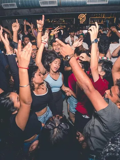 The crowd at Flo Church Street with their hands up, lost in the music. This is the result of a perfectly curated bolly-tech set.