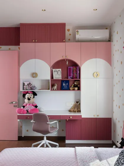 A Dreamy Pink Room Comes to Life: From a playful mood board of pinks and golds to detailed 3D renders, see how we brought this whimsical kid's bedroom to life. The final room, with its arched wardrobe details and integrated study, is a perfect match to the initial vision.
