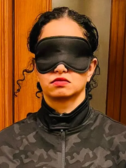 A participant in a corporate session for Honeywell, wearing an eye mask to deepen her focus inward. Blocking out visual stimuli allows the brain to fully immerse in the sound experience.