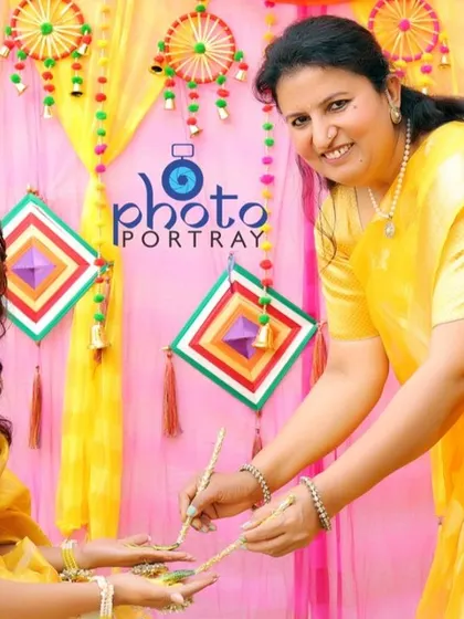Capturing the traditional rituals of the Haldi ceremony, where family members apply turmeric paste to the bride.