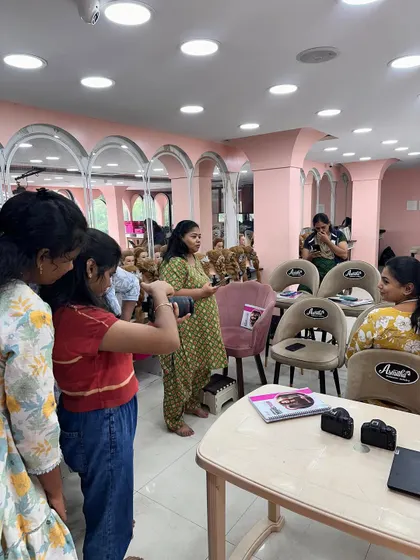 Students getting hands-on experience with DSLR cameras during our Canon-certified photography workshop.