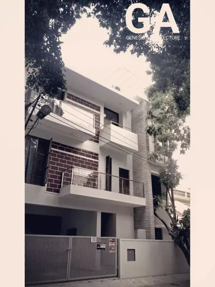 This residential building in HSR Layout uses a combination of exposed brick and white plaster. The design creates visual interest while honoring honest, simple materials, and the balconies provide private outdoor spaces for residents.