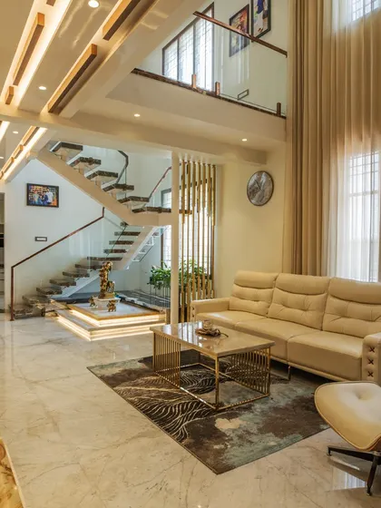 The double-height living room of the 'Opulent Abode' penthouse opens up to views of the terrace garden, ensuring that nature is a constant presence even within the home.